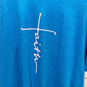 Women’s turquoise/blue as tee shirt XL. has Faith in pink on the front. NWOT